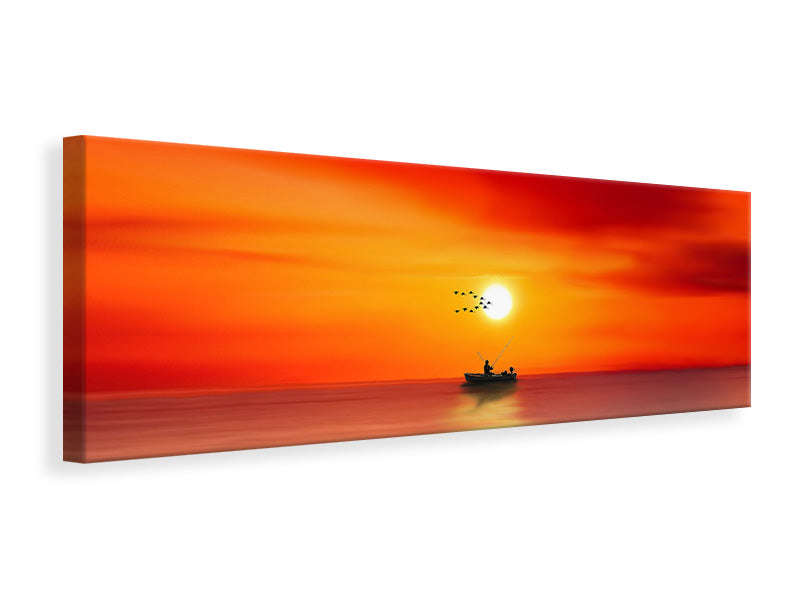 Leinwandbild Panorama Ein Fischer im Sonnenuntergang
